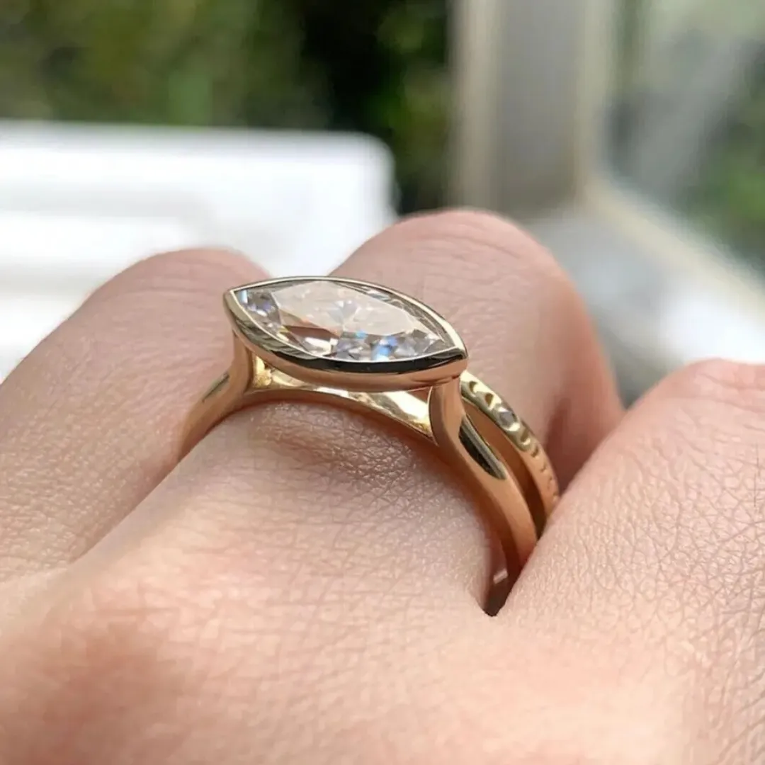 /public/photos/live/Solitaire Marquise Cut Bezel Moissanite Matching Ring Set 564 (1).webp